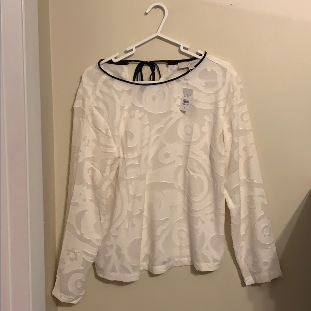 Never worn! White blouse with black trimming.
